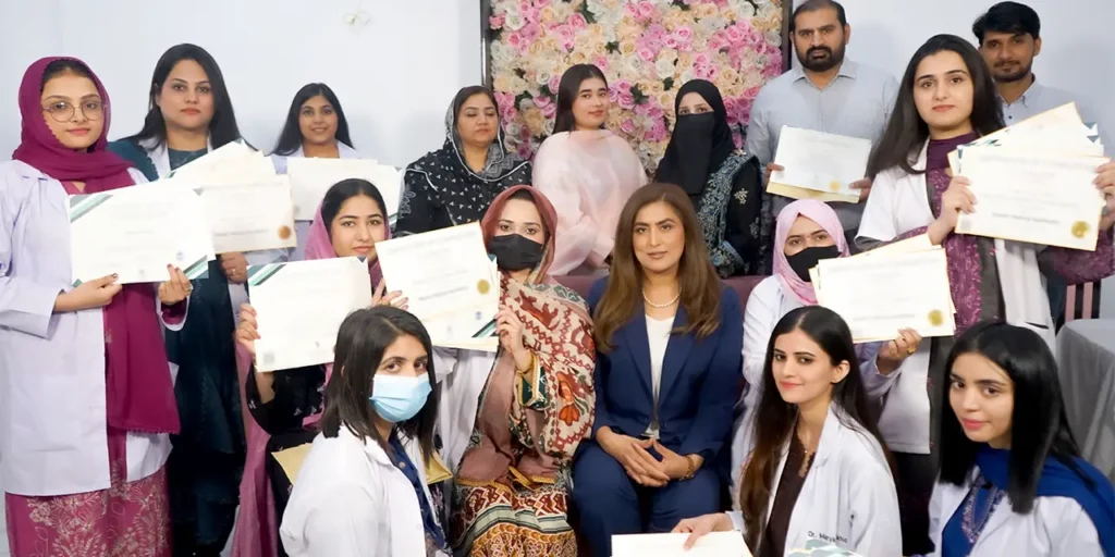 Dr Salma Merritt with aesthetic training graduates at London Aesthetics UK
